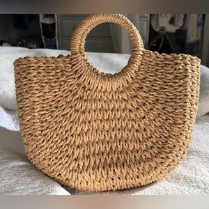 New woven circular rattan bag
13” across
Drawstring closure inside
Inside pocket